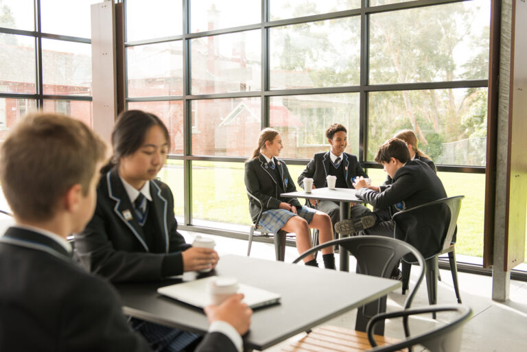 Students sitting in the canteen.