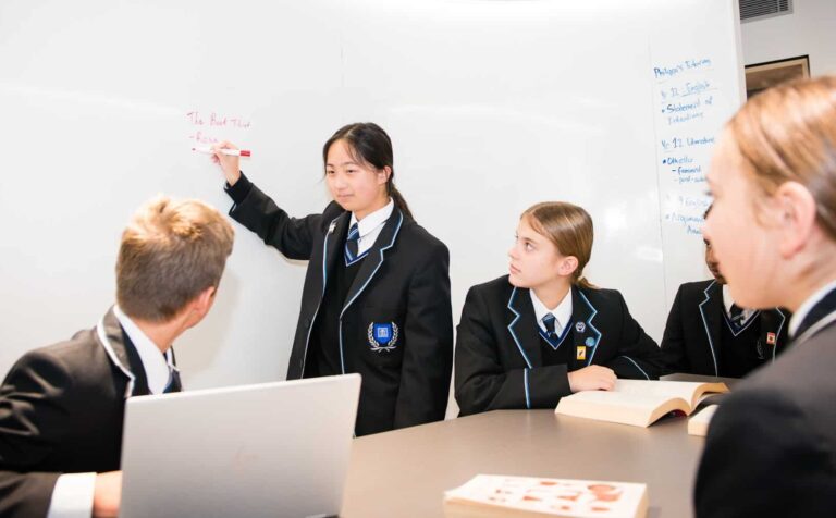 Students brainstorming in a study room.